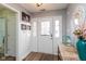 Inviting foyer with decorative glass door, wood floors, and stylish accents at 160 Tracy Ridge Blvd, Whiteland, IN 46184