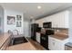 Well-equipped kitchen featuring white cabinetry and an efficient layout for cooking at 160 Tracy Ridge Blvd, Whiteland, IN 46184