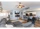 Comfortable living room with a large sectional, open to the kitchen and dining area at 160 Tracy Ridge Blvd, Whiteland, IN 46184