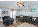 Bright living room featuring vaulted ceiling, gray sectional, and french doors at 160 Tracy Ridge Blvd, Whiteland, IN 46184