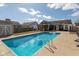 Beautiful backyard with a sparkling pool and a shaded pergola for outdoor relaxation at 160 Tracy Ridge Blvd, Whiteland, IN 46184