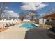 Backyard pool featuring lounge chairs, shed and a wooden fence at 160 Tracy Ridge Blvd, Whiteland, IN 46184