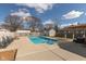 Backyard swimming pool with lounge chairs and a shed surrounded by a wooden fence at 160 Tracy Ridge Blvd, Whiteland, IN 46184