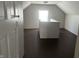This attic features hardwood floors, a window, and white walls at 1624 S Jersey Ave, Muncie, IN 47302