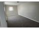 Neutral bedroom featuring new carpeting, natural light, and modern fixtures at 1624 S Jersey Ave, Muncie, IN 47302