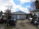 Garage with two parking spaces and basketball hoop in the driveway at 169 E Washington St, Morgantown, IN 46160