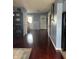 Spacious entryway with hardwood floors, white doors, and neutral wall colors at 203 Village Green Dr, Indianapolis, IN 46227