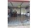 Spacious garage with ample room for storage and parking with epoxy flooring at 203 Village Green Dr, Indianapolis, IN 46227