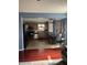 Open-concept kitchen with stainless steel appliances, stone countertops, and tile flooring at 203 Village Green Dr, Indianapolis, IN 46227
