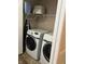 Convenient laundry area featuring a front-load washer and dryer, optimizing space and efficiency at 203 Village Green Dr, Indianapolis, IN 46227