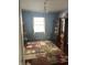 Inviting home office with hardwood floors, leaf-patterned rug, and window providing plenty of natural light at 203 Village Green Dr, Indianapolis, IN 46227
