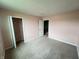 Bedroom with carpeted floors, pastel walls, closet and attached bathroom at 215 Traditions Pass, Greenwood, IN 46143