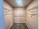 Walk-in closet with shelving, carpeted floors, and pastel walls at 215 Traditions Pass, Greenwood, IN 46143