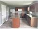 Kitchen featuring stainless steel appliances, dark cabinets, and an island at 215 Traditions Pass, Greenwood, IN 46143