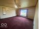 Inviting living room with natural light and cozy carpeting creates a warm and inviting atmosphere at 2310 Mellen Rd, Indianapolis, IN 46231