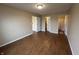 Spacious bedroom with bright walls and wood-look floors at 2399 Orchard Creek Dr, Columbus, IN 47201
