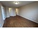 Spacious bedroom with bright walls and wood-look floors at 2399 Orchard Creek Dr, Columbus, IN 47201