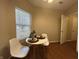 Cozy dining area with a view from the large window at 2399 Orchard Creek Dr, Columbus, IN 47201