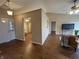 Cozy living room with hardwood floors, neutral walls, and an open doorway to a dining area at 2399 Orchard Creek Dr, Columbus, IN 47201