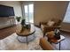 Tastefully decorated living room with hardwood floors, area rug, and sliding glass doors at 2399 Orchard Creek Dr, Columbus, IN 47201
