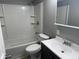 Bright bathroom featuring a shower-tub combo, modern vanity, and a mirrored medicine cabinet at 2905 N Barr St, Muncie, IN 47303