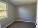 Bedroom featuring neutral walls, plush carpeting and bright window at 2905 N Barr St, Muncie, IN 47303