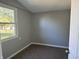 Cozy bedroom with neutral walls, plush carpeting and bright window at 2905 N Barr St, Muncie, IN 47303