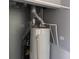 Utility area featuring a hot water heater and furnace components, painted with neutral gray at 2905 N Barr St, Muncie, IN 47303