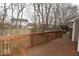 The back deck overlooks the yard, lined with mature trees and offering privacy and outdoor enjoyment at 3258 Starlite Ct, Columbus, IN 47203