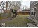 The backyard offers a playset, green space, privacy fence, and room for outdoor activities and relaxation at 3258 Starlite Ct, Columbus, IN 47203