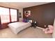 Cozy bedroom with a large window, plush pillows on the bed, and a soft, inviting ambiance at 3258 Starlite Ct, Columbus, IN 47203