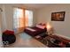 Cozy bedroom featuring plush carpeting, window with sheer curtains, and a comfortable bed at 3258 Starlite Ct, Columbus, IN 47203