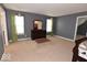Spacious bedroom with soft carpeting and a dresser under window for ample storage at 3258 Starlite Ct, Columbus, IN 47203