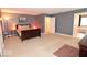 Large bedroom features soft carpet, contemporary gray paint, and a connected bathroom at 3258 Starlite Ct, Columbus, IN 47203