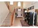 Bright foyer with high ceilings, staircase, tiled flooring, and front door at 3258 Starlite Ct, Columbus, IN 47203