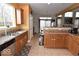 Well-lit kitchen with stainless steel appliances, tile flooring, and ample counter space at 3258 Starlite Ct, Columbus, IN 47203