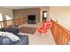Relaxing loft featuring plush carpeting, comfortable seating, and a large TV for entertainment at 3258 Starlite Ct, Columbus, IN 47203