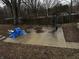 A backyard patio is furnished with a table, chairs, and fire pit at 326 W State Road 42, Mooresville, IN 46158