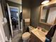 This bathroom features a toilet, single sink vanity, and tile flooring at 326 W State Road 42, Mooresville, IN 46158