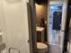 A bathroom view showcases a shower, toilet, and single sink vanity at 326 W State Road 42, Mooresville, IN 46158