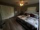 Bedroom with spacious closet, stylish headboard, and wood look floors at 326 W State Road 42, Mooresville, IN 46158