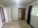 This bedroom features neutral walls, closet, window and a door with access to other parts of the house at 326 W State Road 42, Mooresville, IN 46158