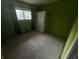 Unfurnished bedroom with green walls and carpet flooring at 326 W State Road 42, Mooresville, IN 46158