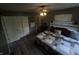 Well-lit bedroom featuring stylish bedding, ceiling fan and neutral wall paint at 326 W State Road 42, Mooresville, IN 46158