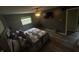 Bedroom with vinyl flooring, ceiling fan, and window views at 326 W State Road 42, Mooresville, IN 46158