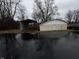 A detached garage and car port are displayed along the driveway at 326 W State Road 42, Mooresville, IN 46158