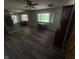 Spacious living room with wood-look floors, large mirror, and furniture at 326 W State Road 42, Mooresville, IN 46158