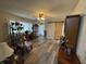 Bright living room with new flooring, a barn door, and large windows, creates a welcoming atmosphere at 326 W State Road 42, Mooresville, IN 46158