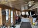 An unfinished sun room features a ceiling fan, windows, and wood floor at 326 W State Road 42, Mooresville, IN 46158