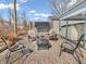 Backyard patio area with solar panel, stone ground cover, and chairs surrounding a firepit at 4592 Gordon Dr, Plainfield, IN 46168